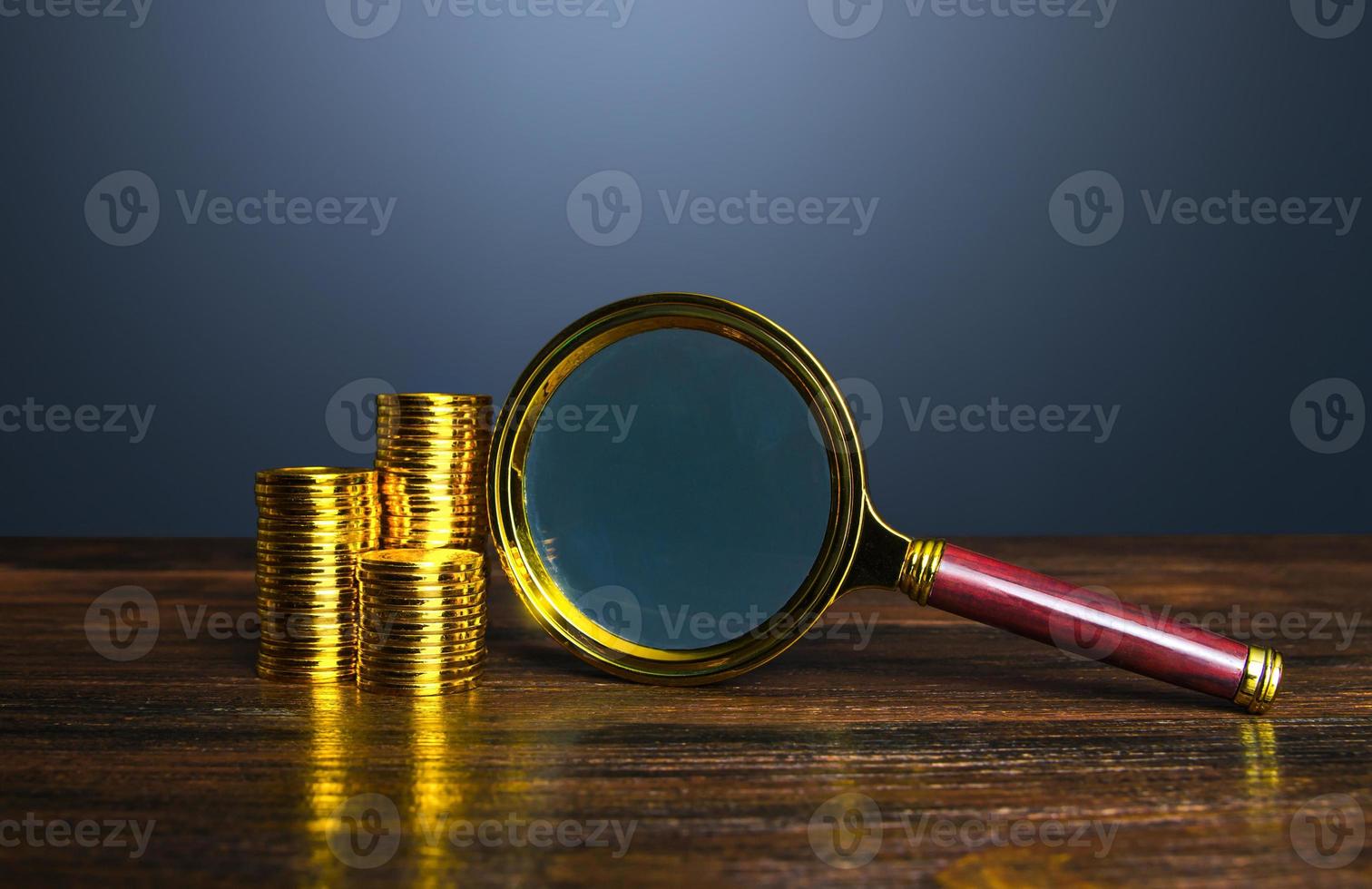 Money and a magnifying glass. Personal finance and corporate accounting. Investigate financial fraud or illegal activities. Transparency and accountability in financial transactions. Identify risks photo