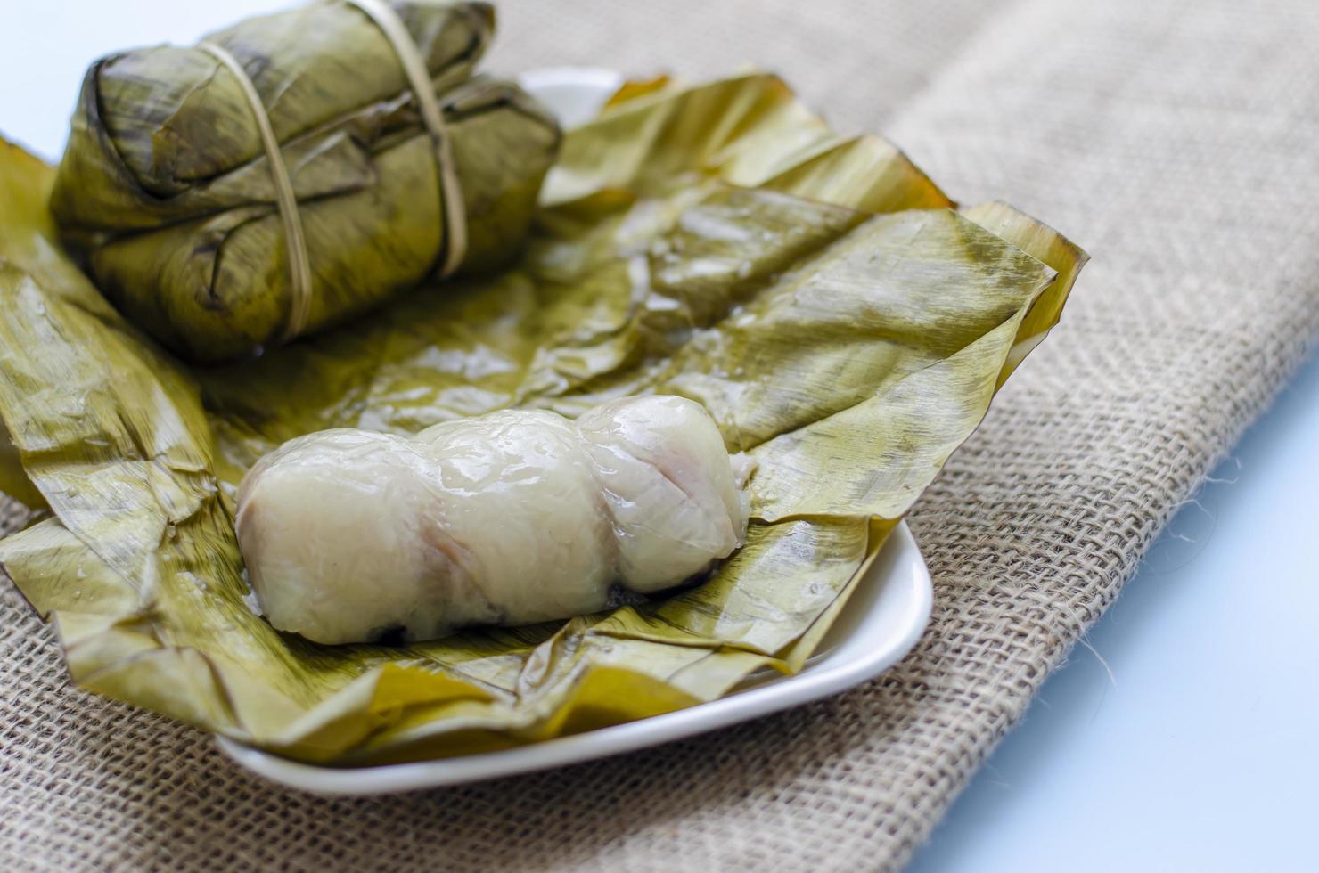 Closeup view Khao Tom Mad or Dessert sticky rice There is a banana or taro filling inside. Ancient Thai desserts. photo