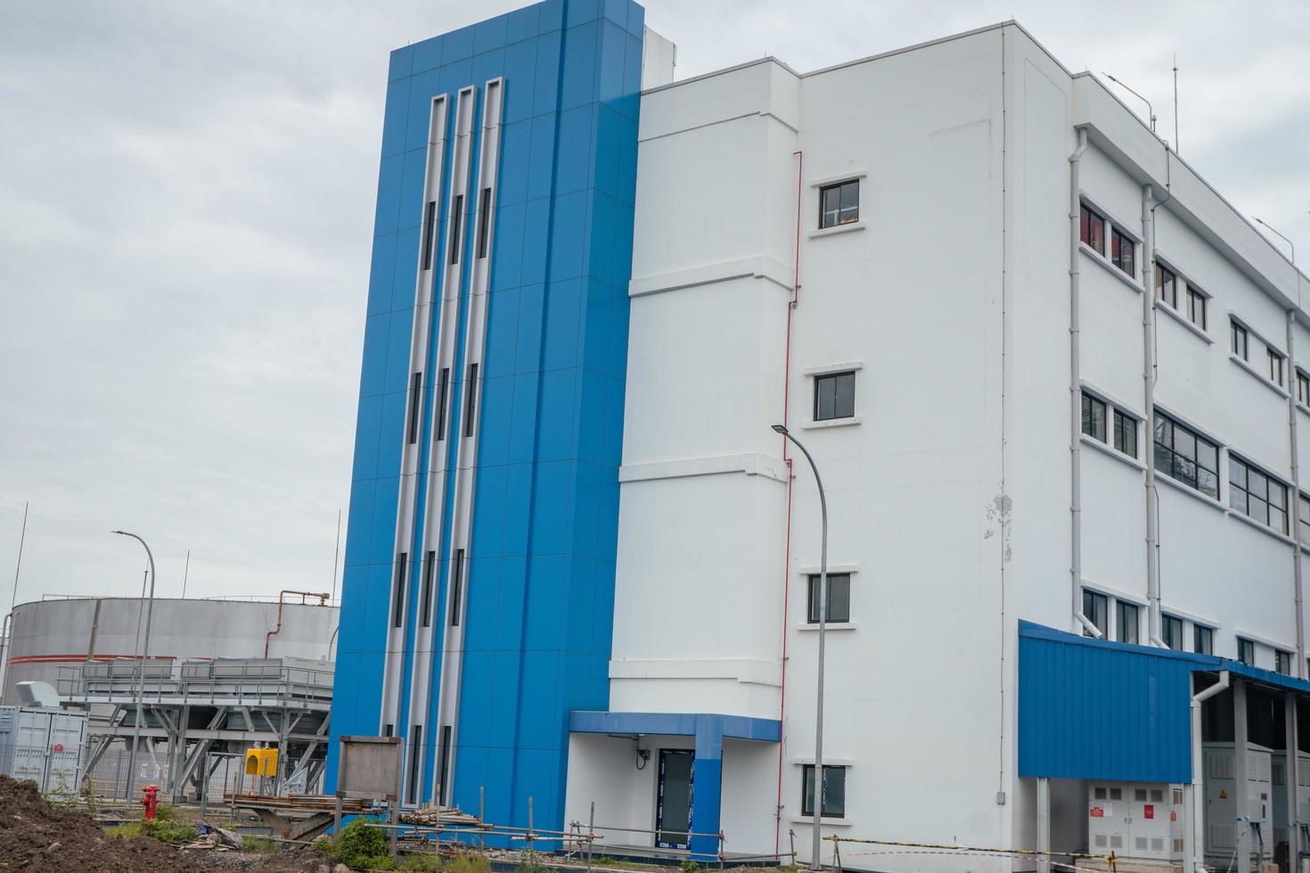 Admin building on the power plant area. The photo is suitable to use for industry background photography, power plant poster and electricity content media.