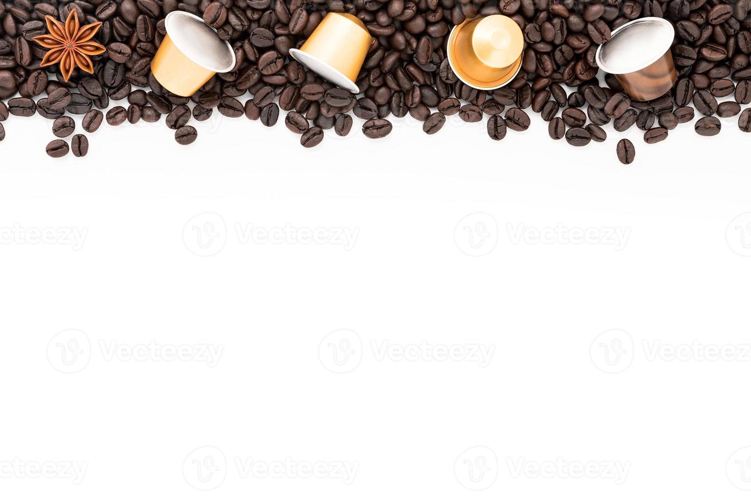 Dark roasted coffee beans setup on white background with copy space. photo