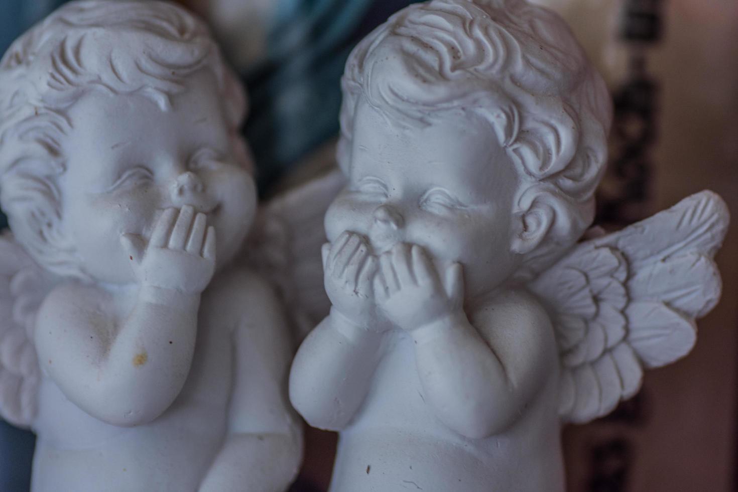 two white little angels are smiling together detail photo