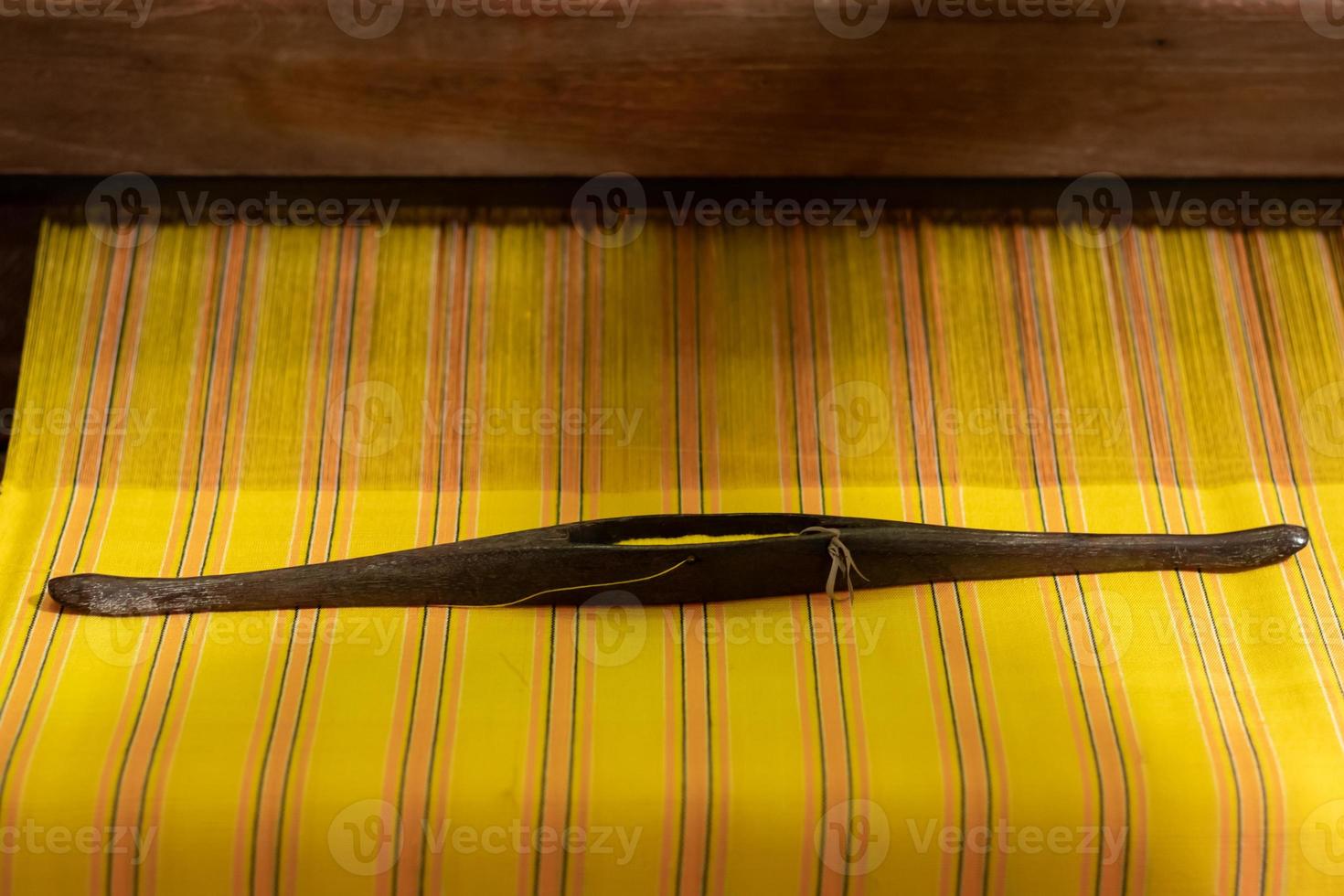 The yarn prepared inside the weaving machine is preparation for weaving local fabrics because local fabrics are handmade and have a high price because it takes quite a long time to weave. photo