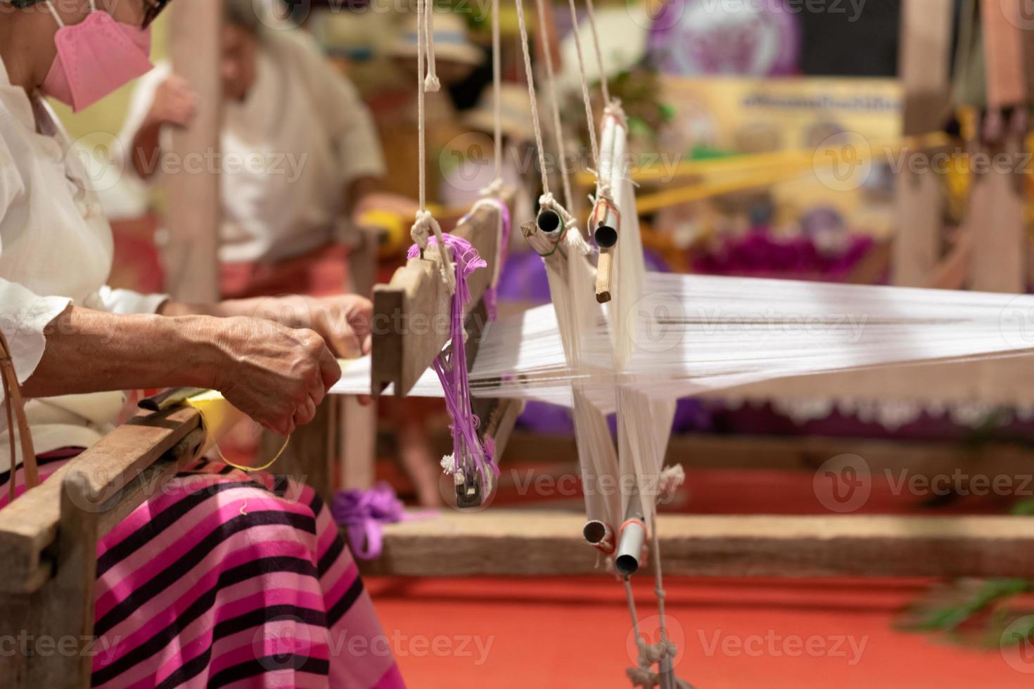 The yarn prepared inside the weaving machine is preparation for weaving local fabrics because local fabrics are handmade and have a high price because it takes quite a long time to weave. photo