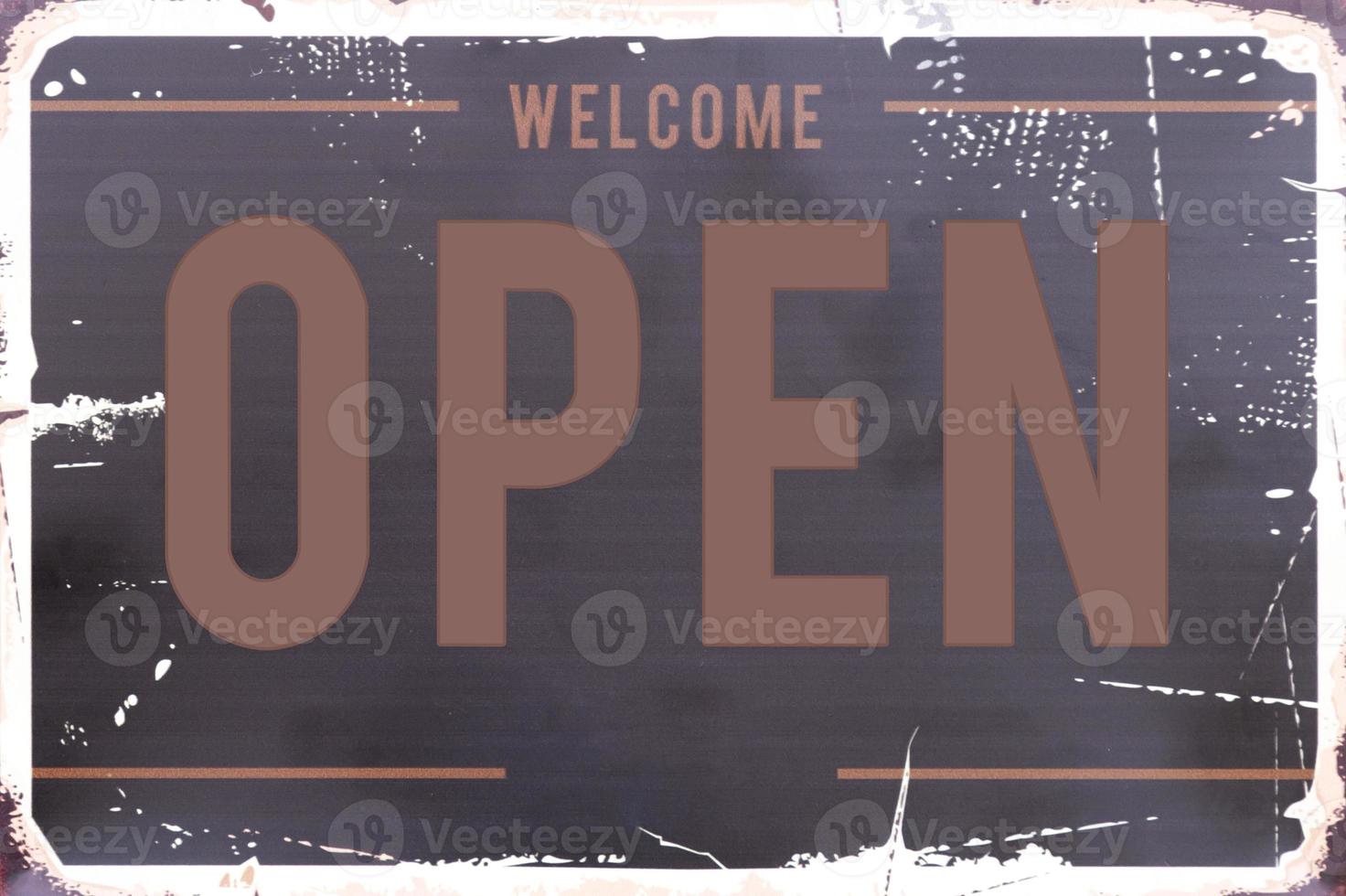 Mock up sign with message Welcome OPEN on brown background photo
