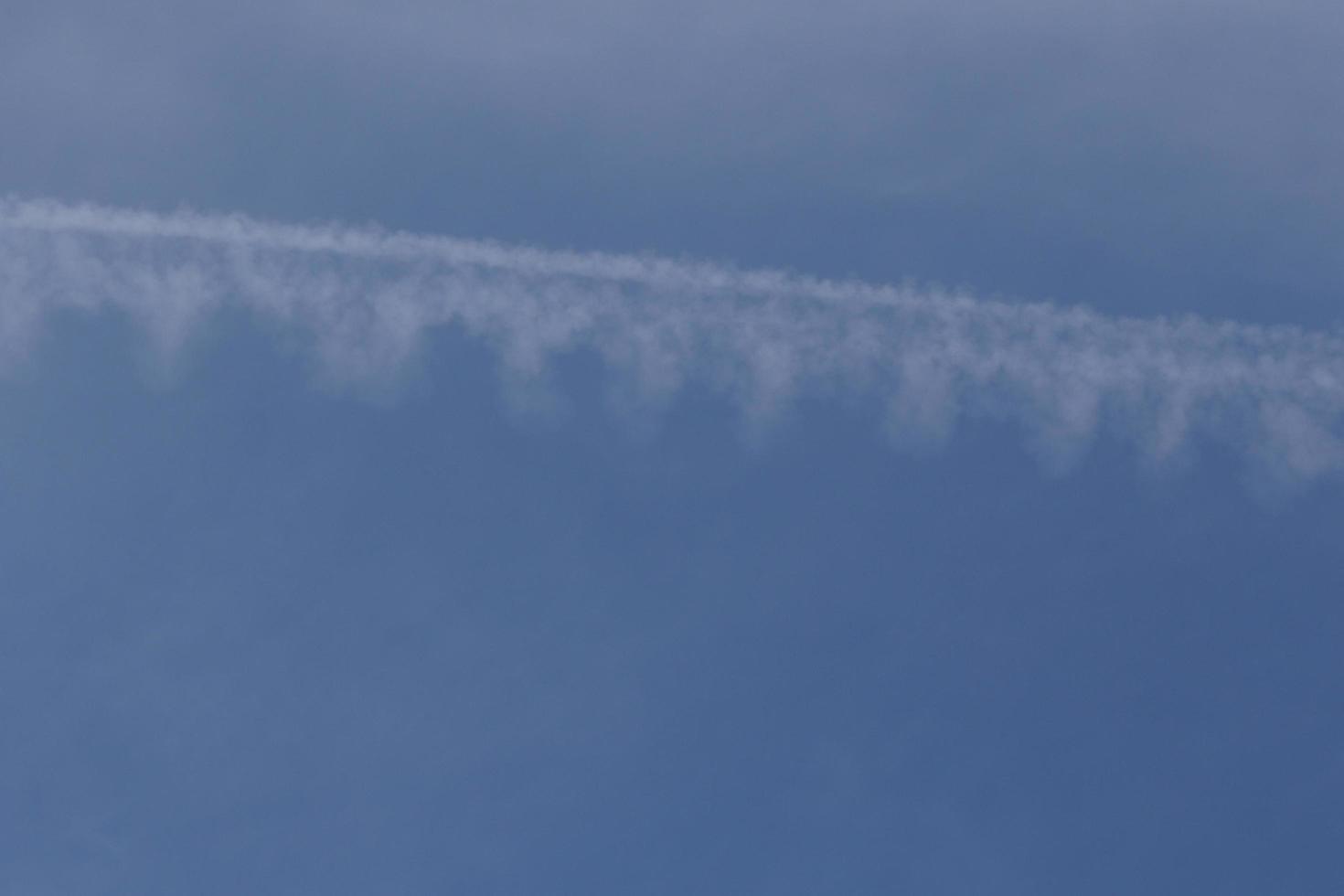 Clear blue sky and white clouds photo
