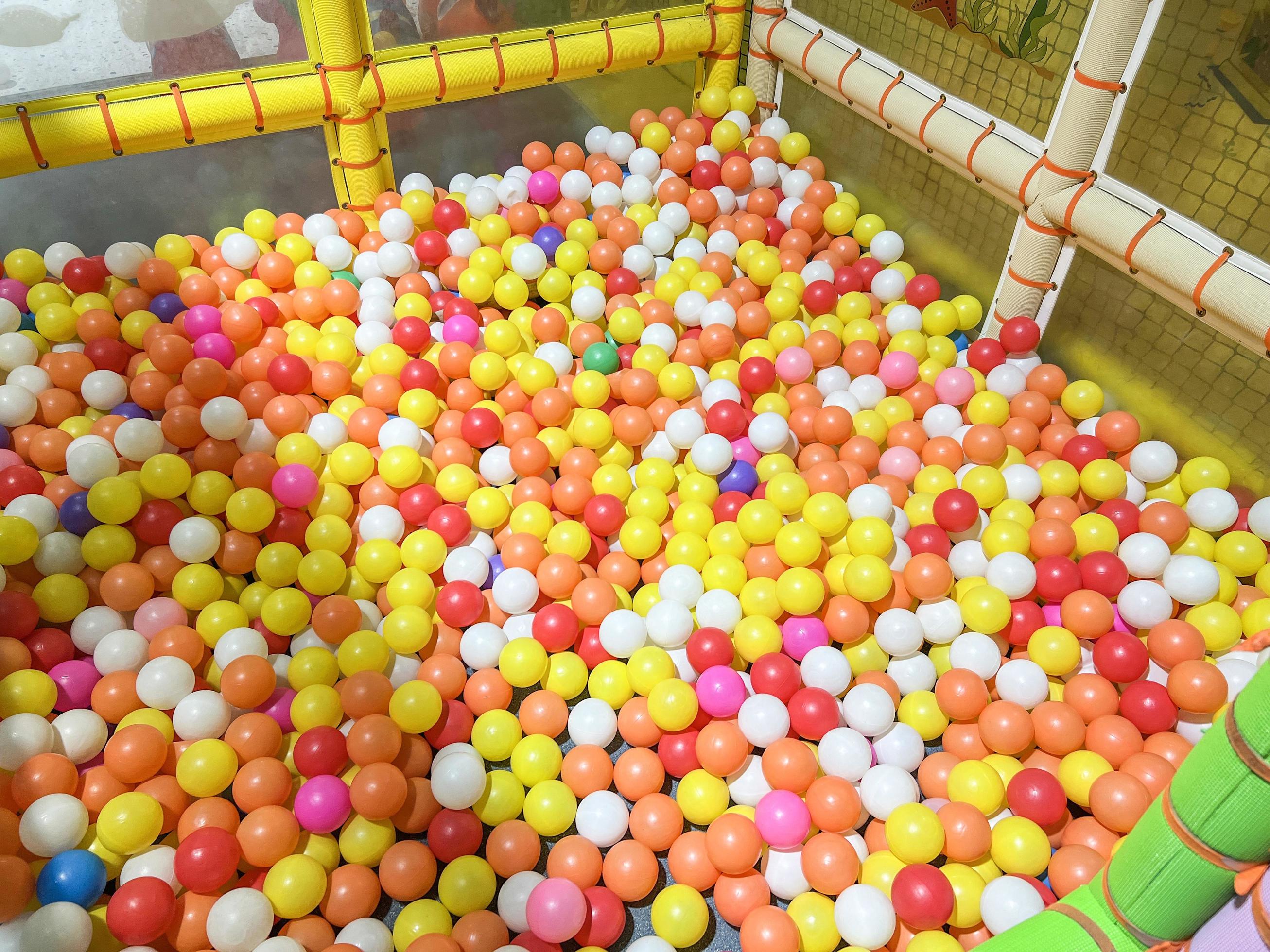 Children playground indoor at amusement park with colorful balls for