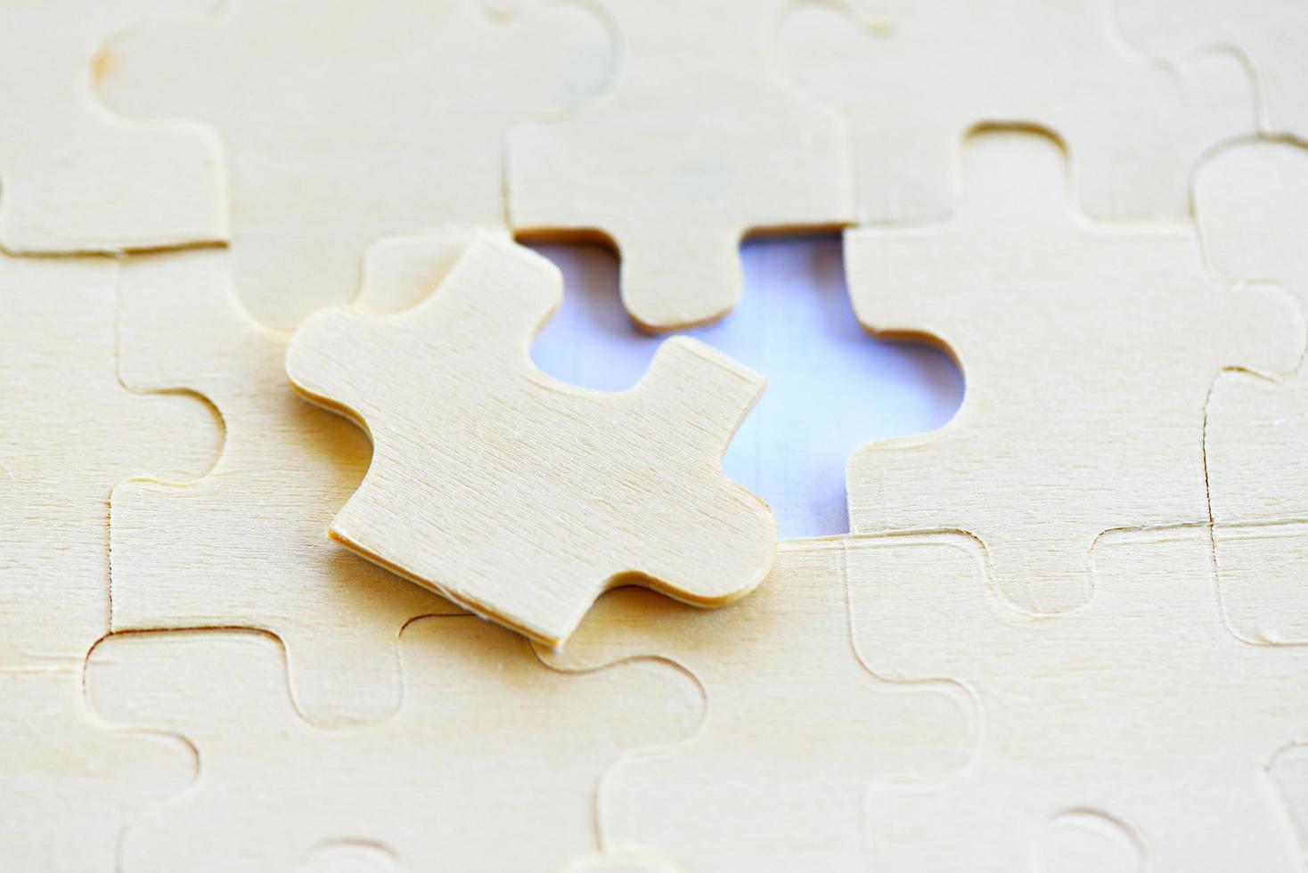 Jigsaw puzzle on white background top view - jigsaw piece connecting business solutions success and strategy concept photo