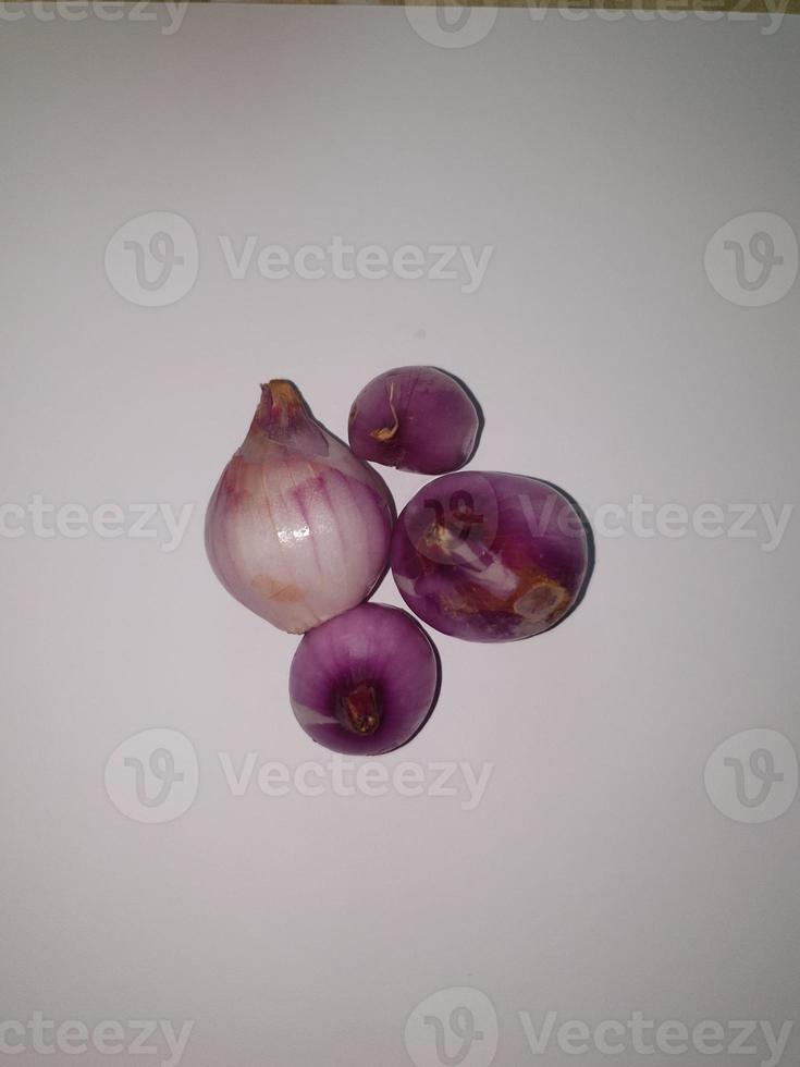 Red Onions Bawang Merah or shallots on a white background. photo