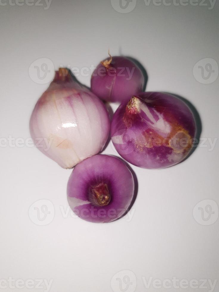 Red Onions Bawang Merah or shallots on a white background. photo