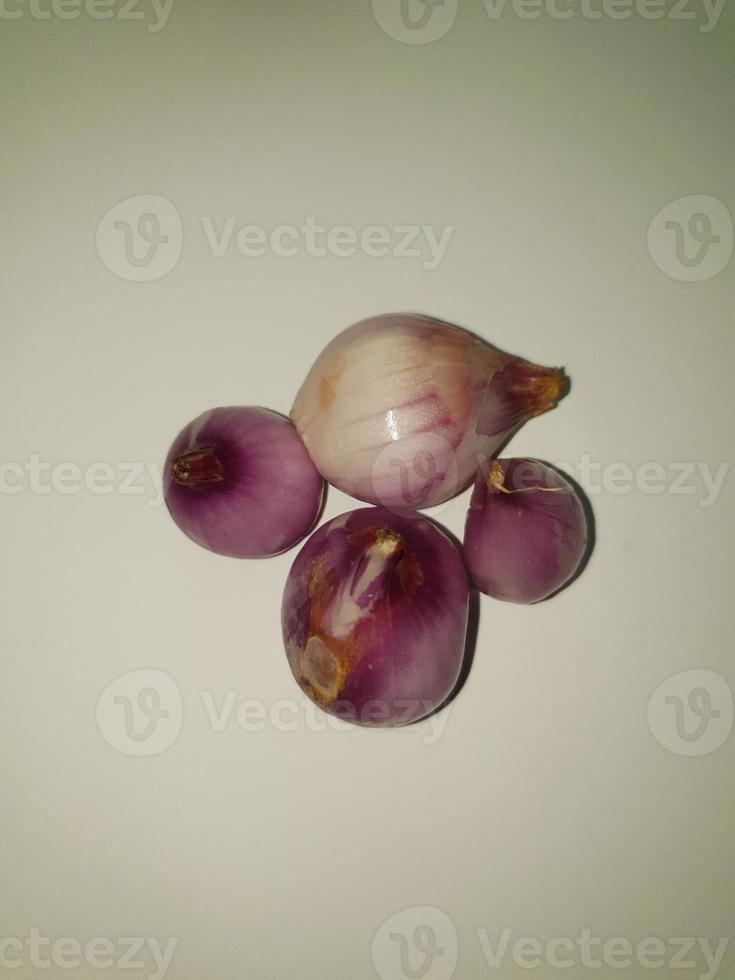 Red Onions Bawang Merah or shallots on a white background. photo