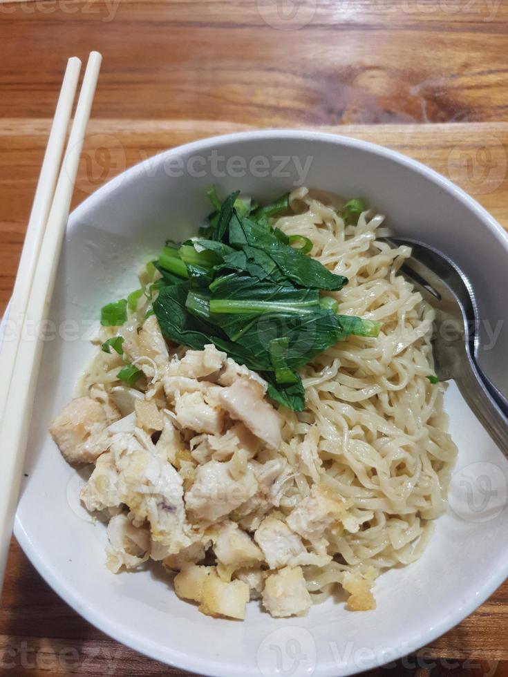 Chicken noodles with dumpling soup that is already cooked looks very delicious and tempting. photo