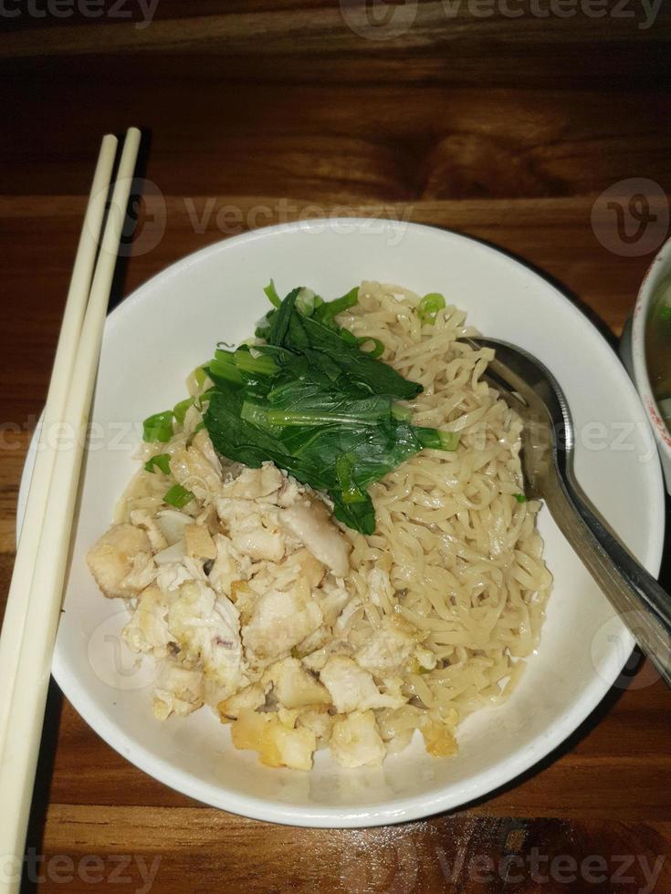 Chicken noodles with dumpling soup that is already cooked looks very delicious and tempting. photo