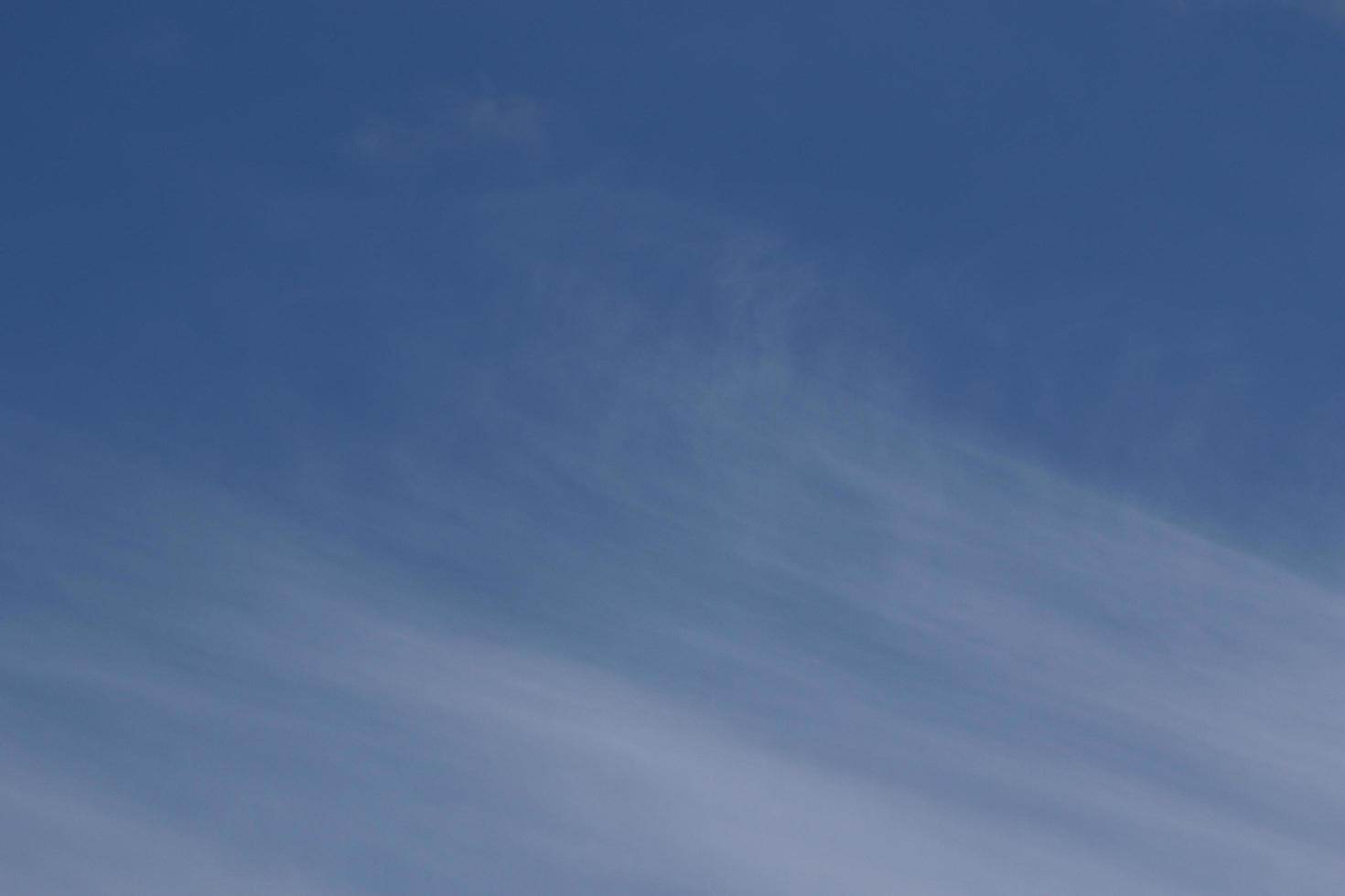 Clear blue sky and white clouds photo