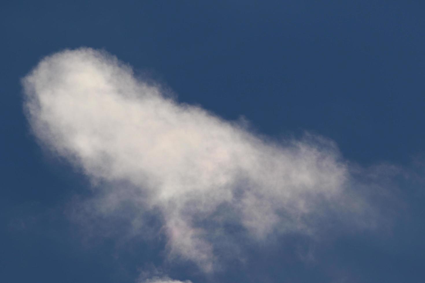 Clear blue sky and white clouds photo