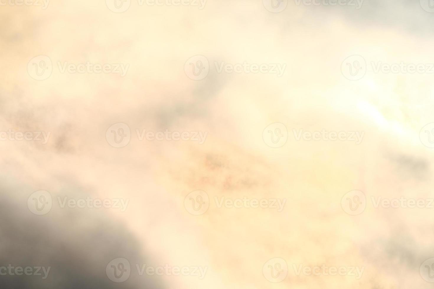 Sun behind the darl clouds photo