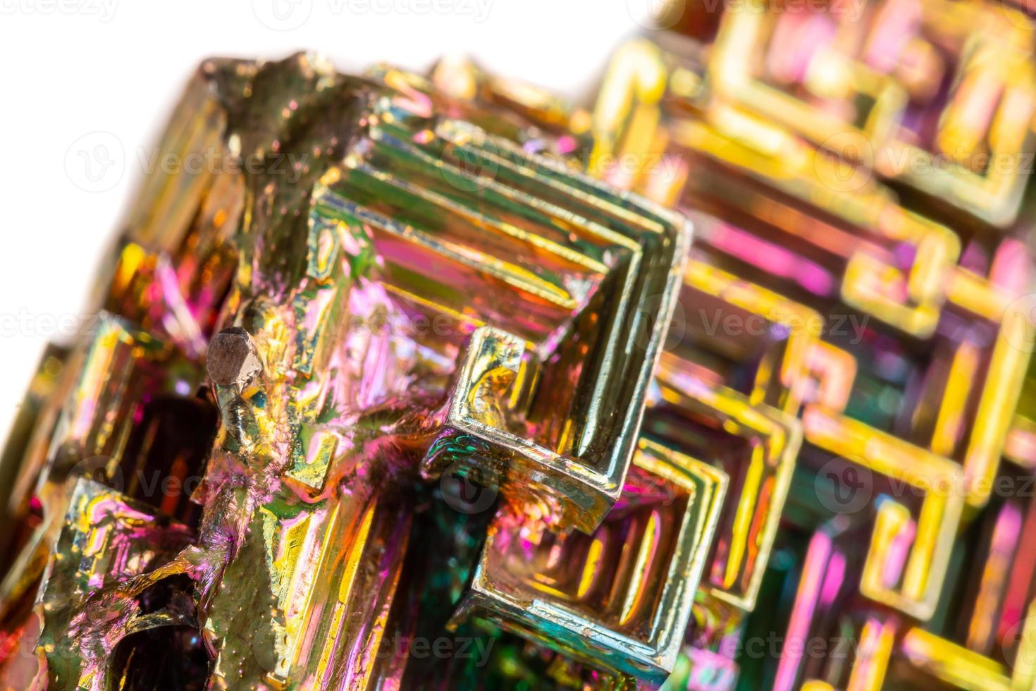 Macro of the mineral bismuth stone on a white background photo