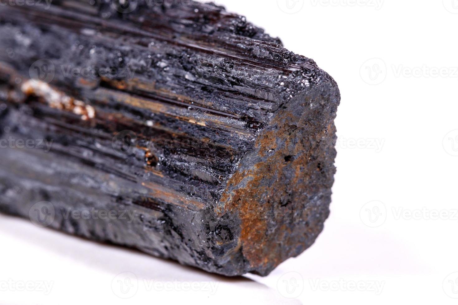 macro mineral stone sherle, schorl, black tourmaline on white background photo
