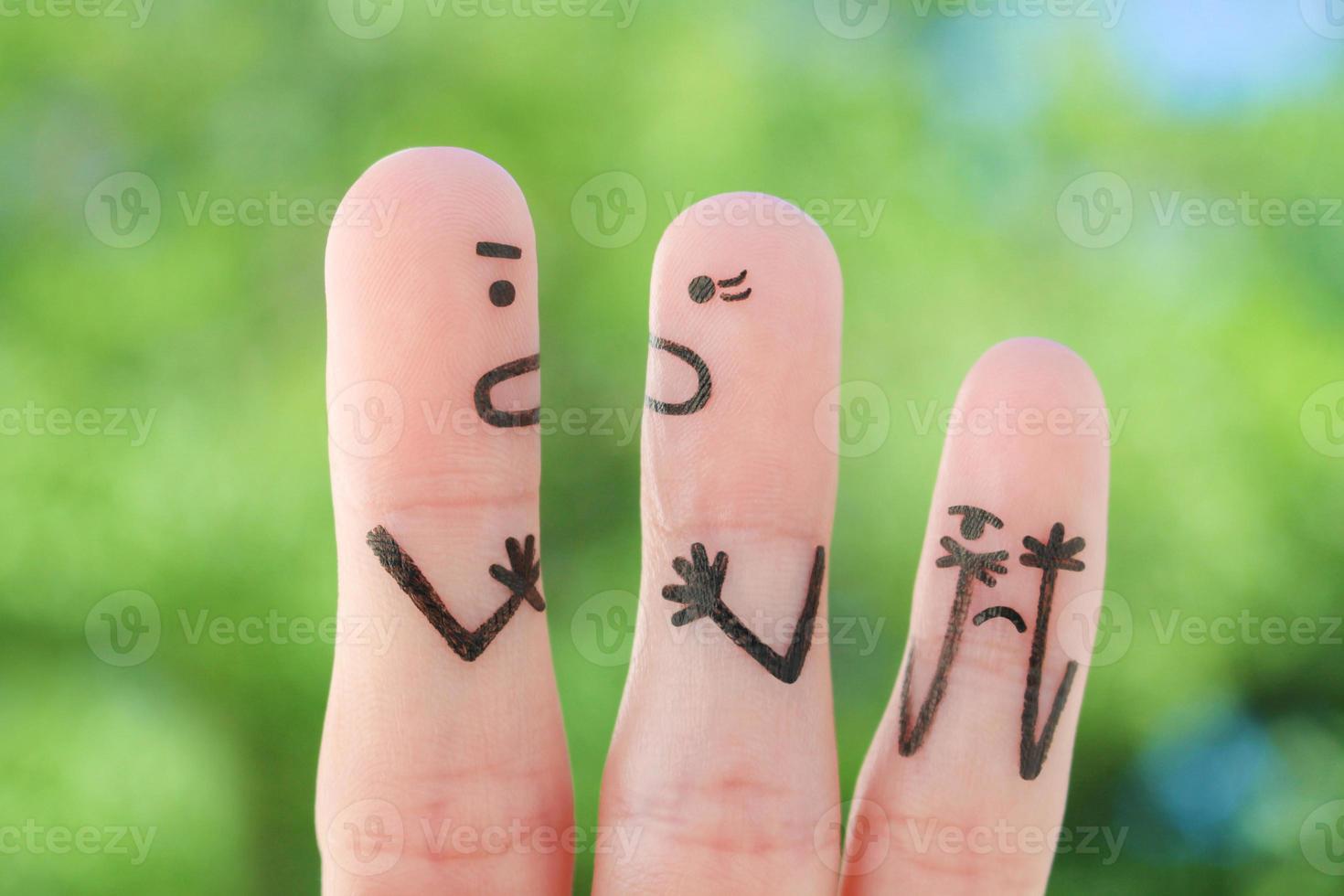 Fingers art of family during quarrel. Concept of parents quarrel, child was upset. photo