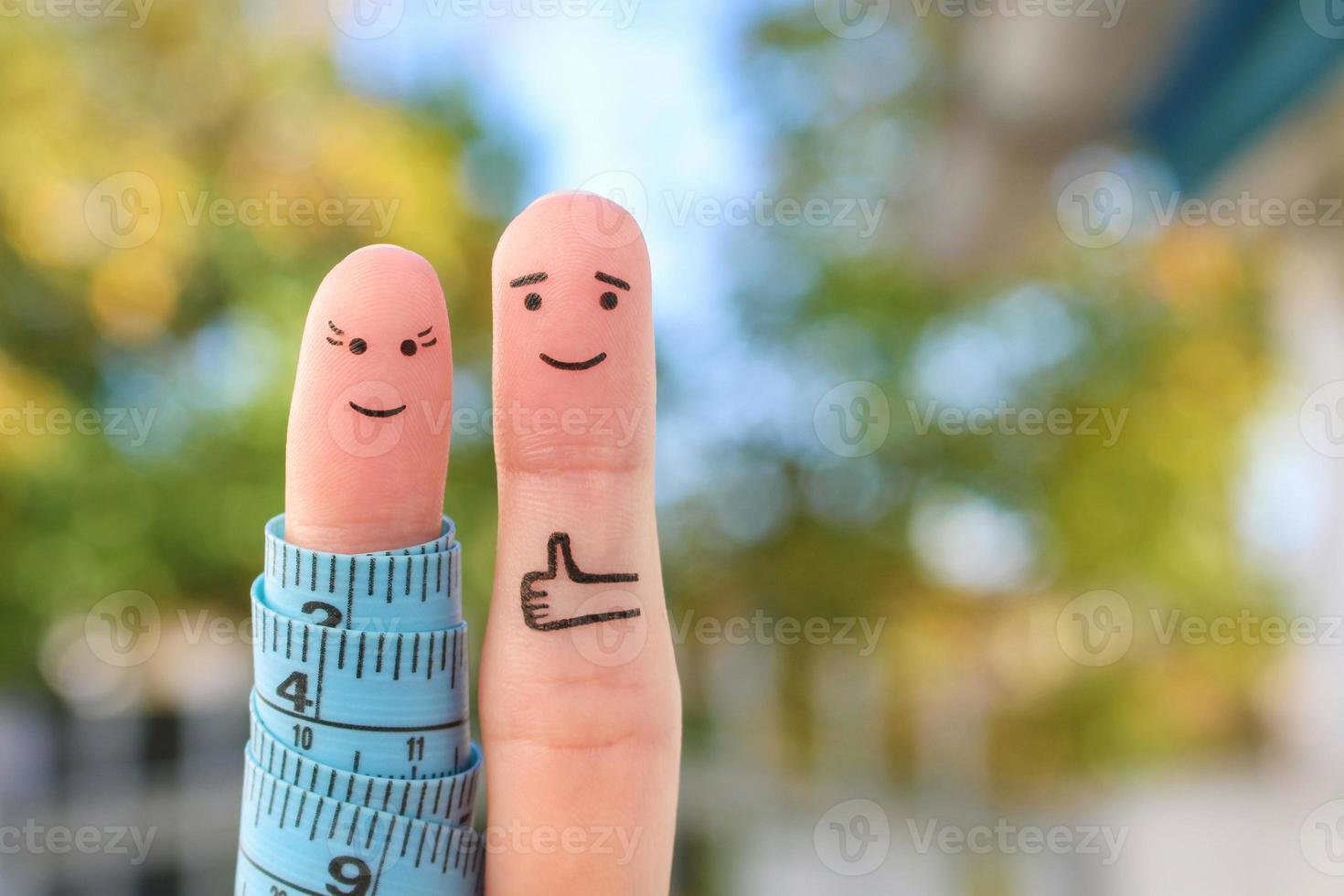 Fingers art of a Happy couple with tape measure. Concept of losing weight together. photo