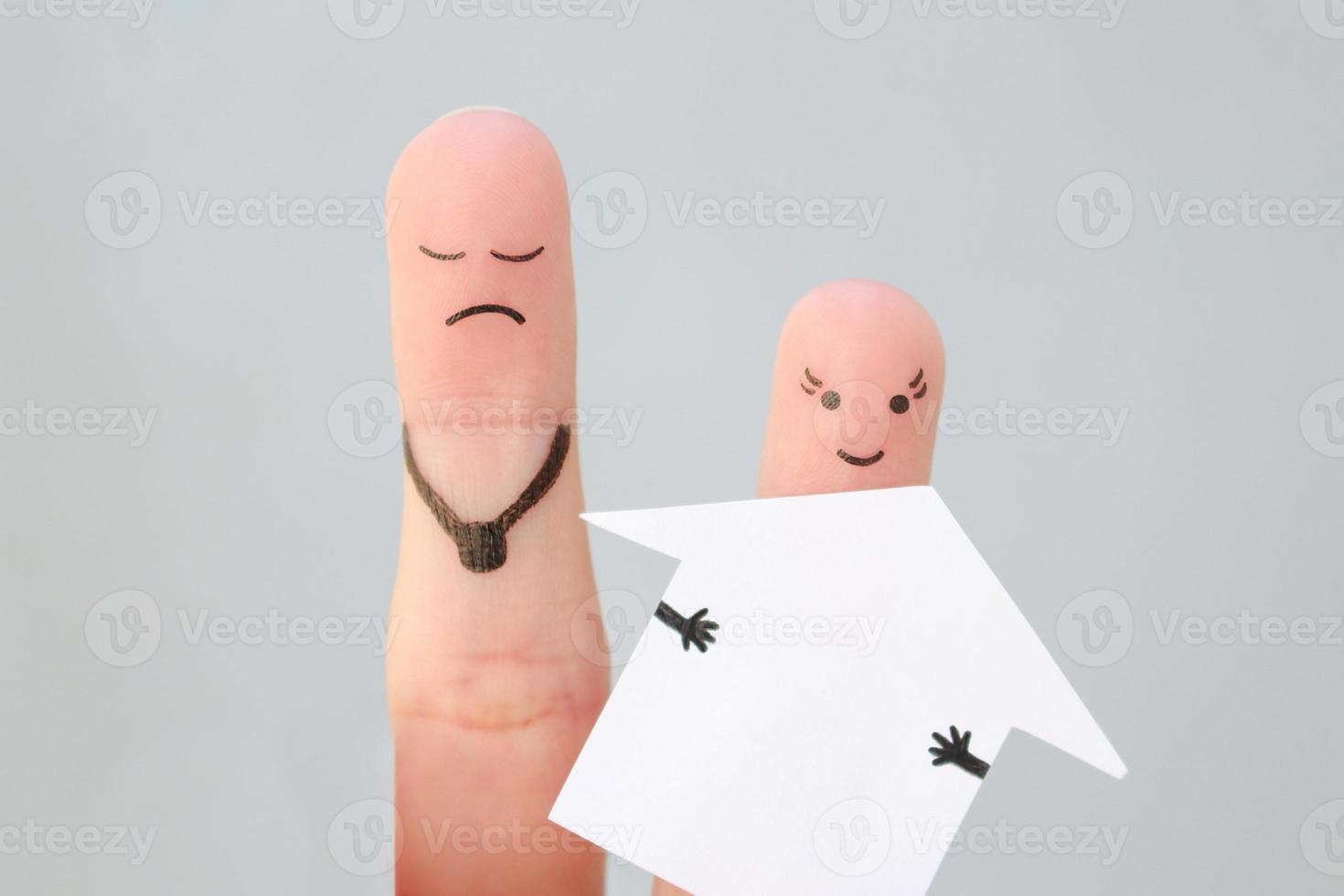 Fingers art of family during quarrel. Concept of man and woman divide house after divorce. photo