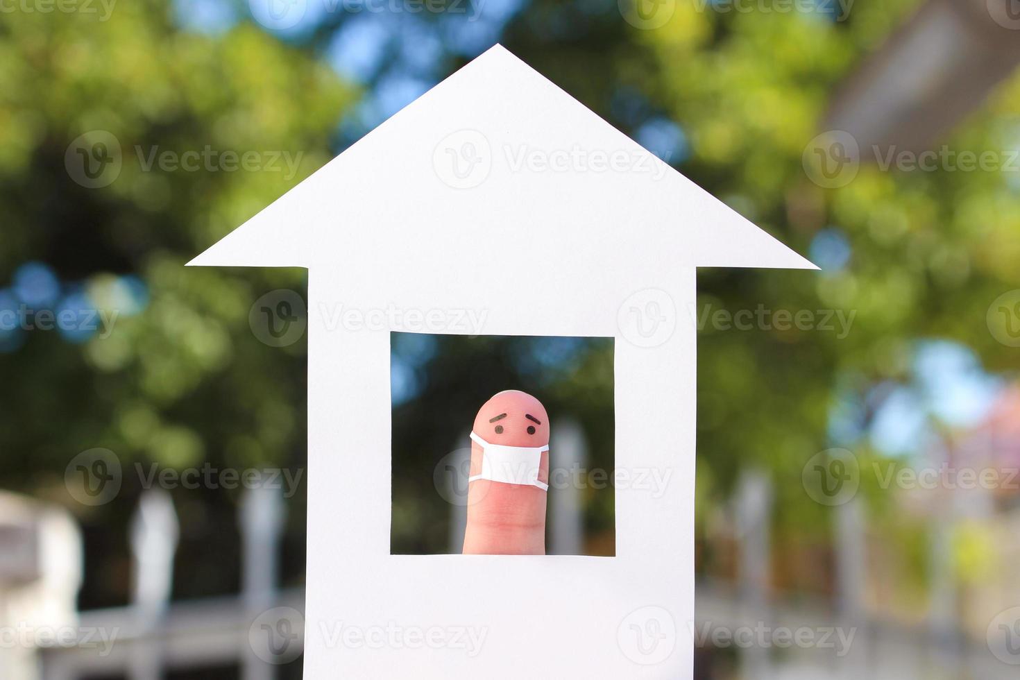 Fingers art of lonely man with face mask at home. photo