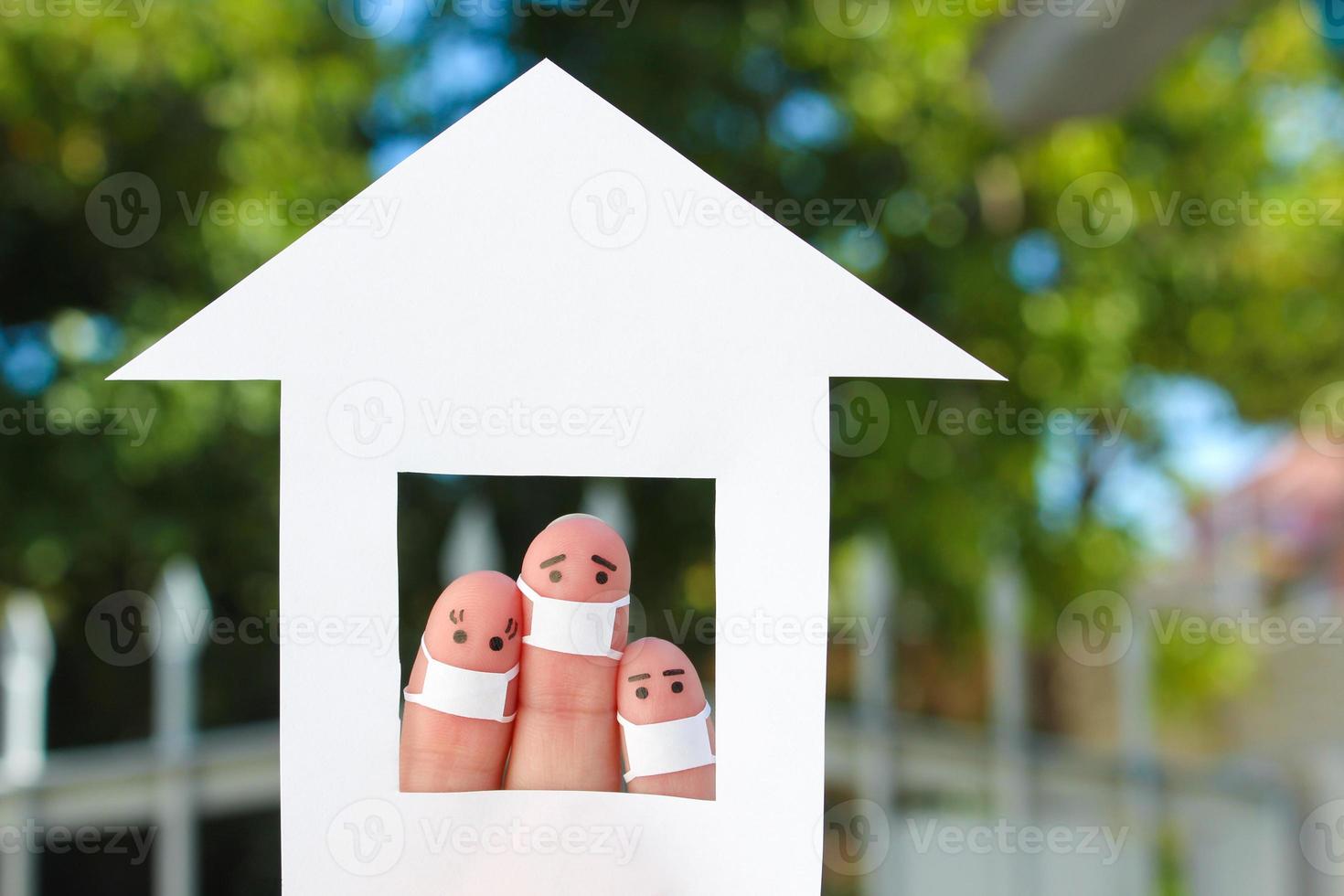 Fingers art of family with face mask at home. photo