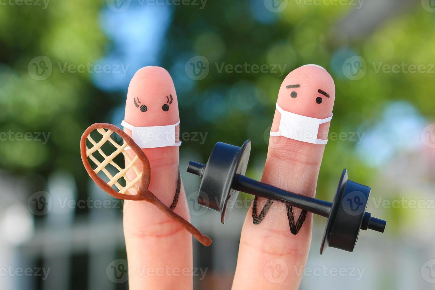 Fingers art of happy couple in medical mask from COVID-2019. Concept of family in sports. photo