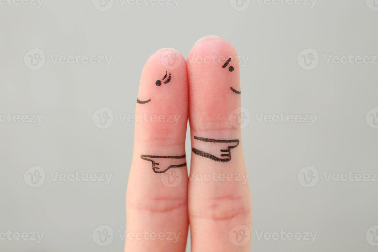 Fingers art of couple. Concept of a couple pointing in different directions. photo