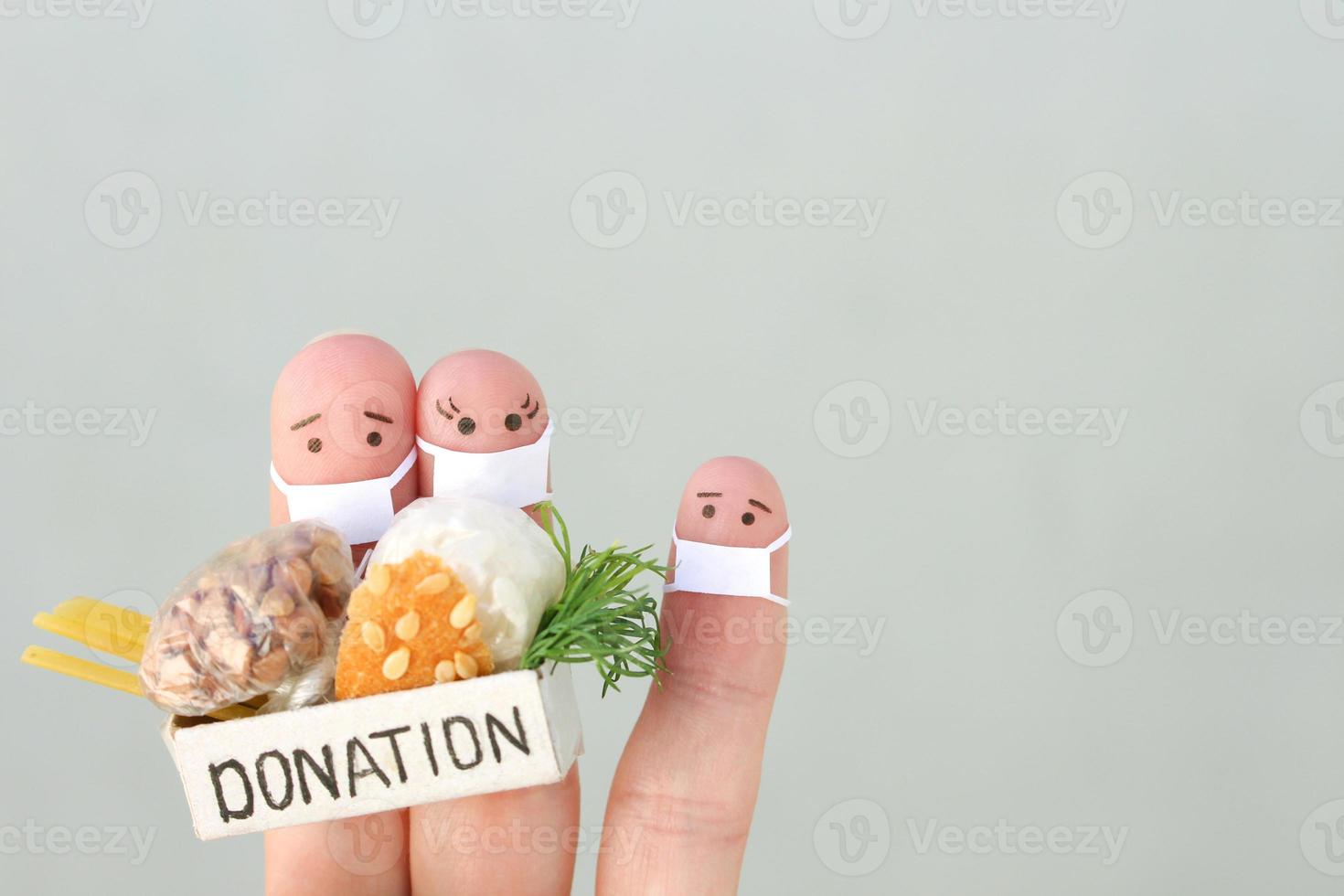 Fingers art of family with face mask. Man  and woman holding donation box with food. photo