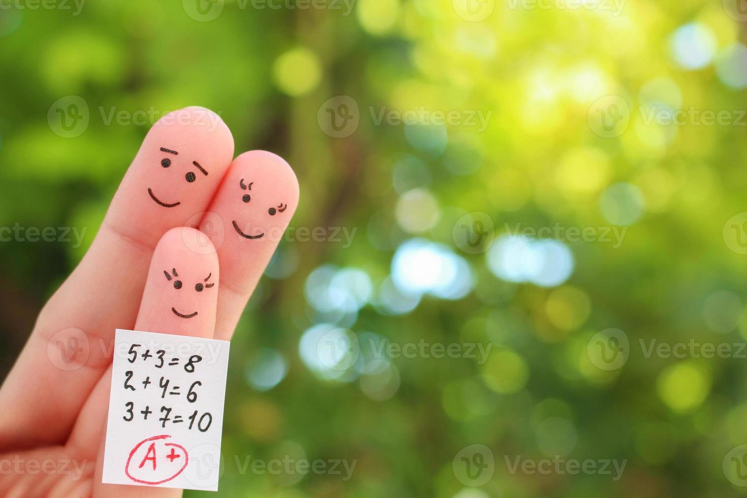 Fingers art of happy family. Concept of child got good grade. photo