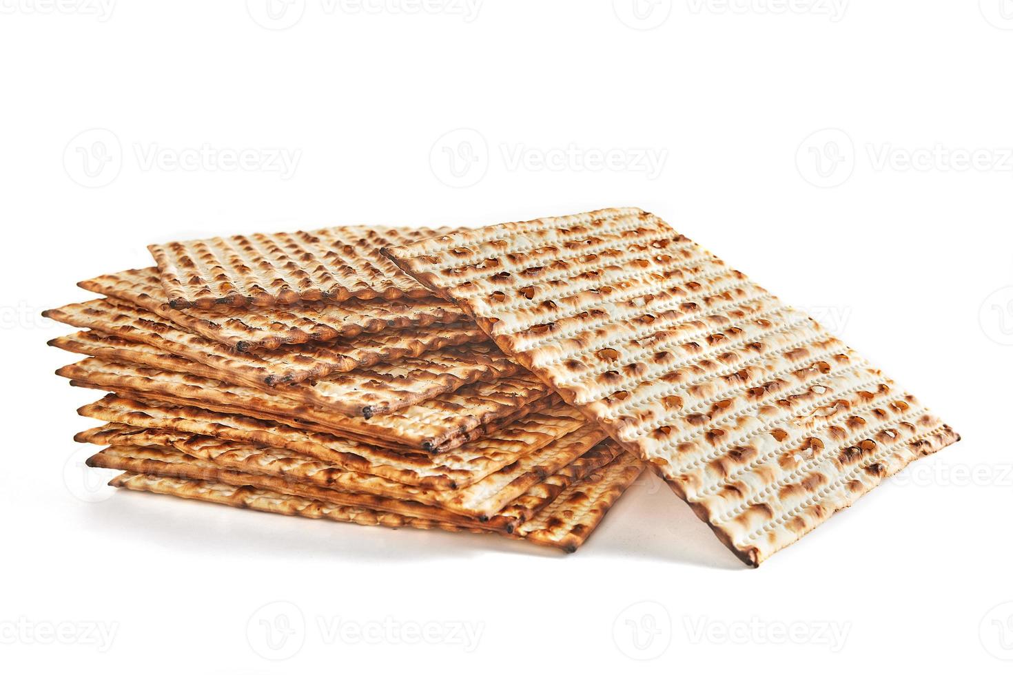 Pesach celebration concept - Jewish holiday Pesach. Stacked matzah isolated on white background photo