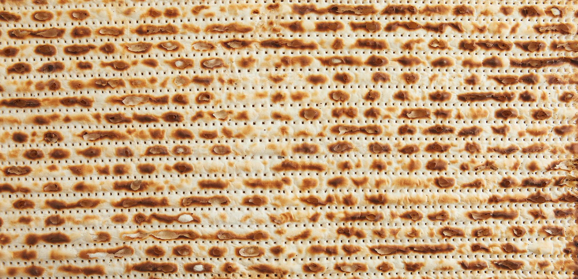 Pesach celebration concept - Jewish holiday Pesach. Texture background from matzah for banner and screensavers photo