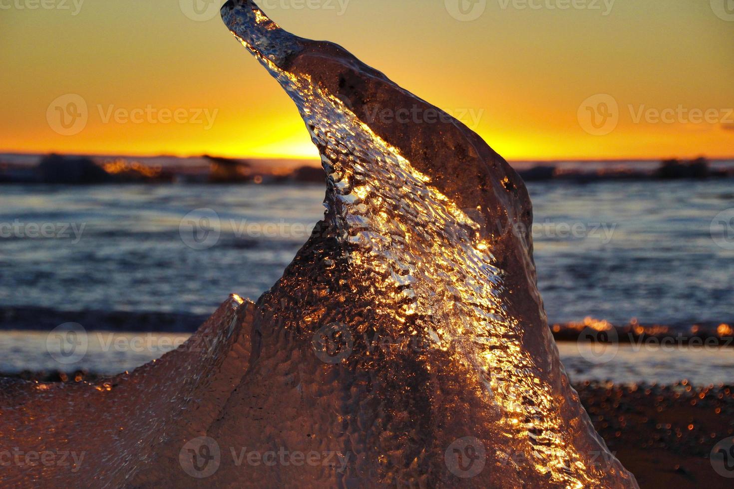 Ice on the beach at sunrise photo