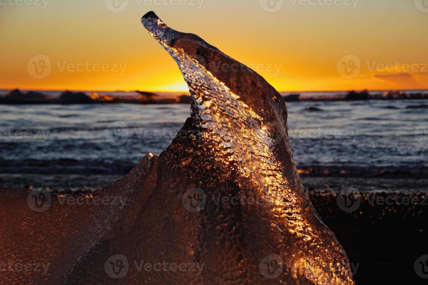 Ice on the beach at sunrise photo
