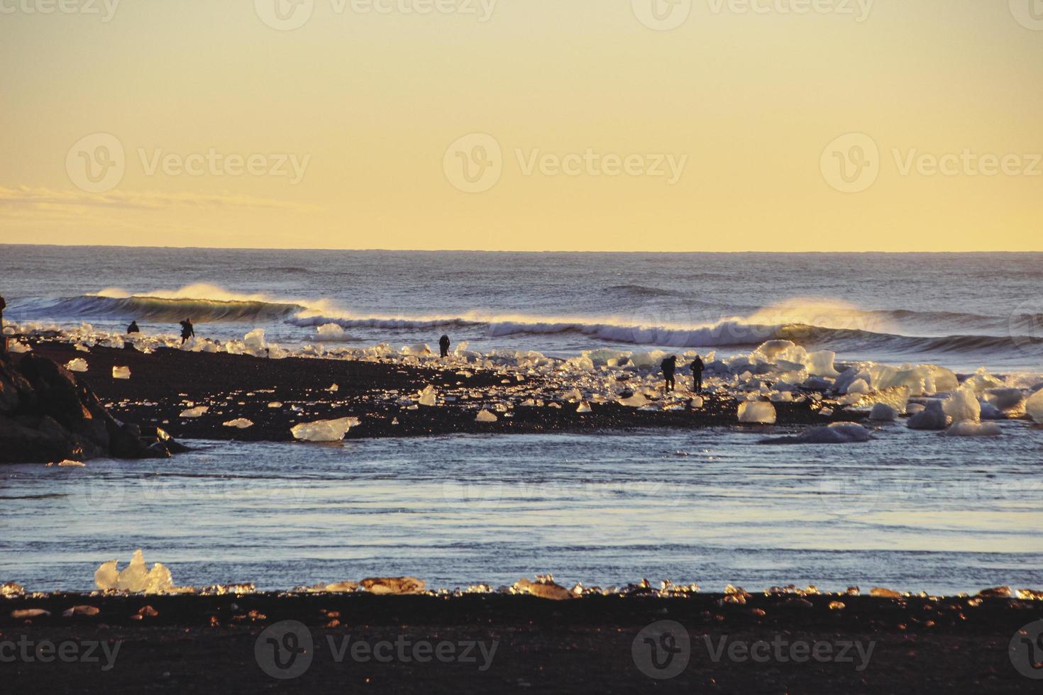 Sunrise at diamond beach, near jokulsarlon lagoon, Iceland photo