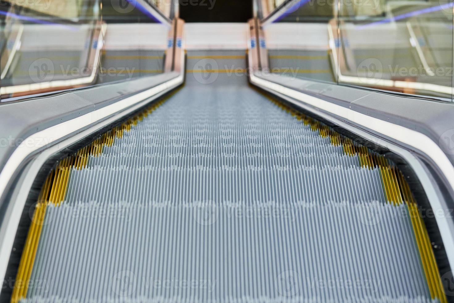 Escalator in shopping center photo