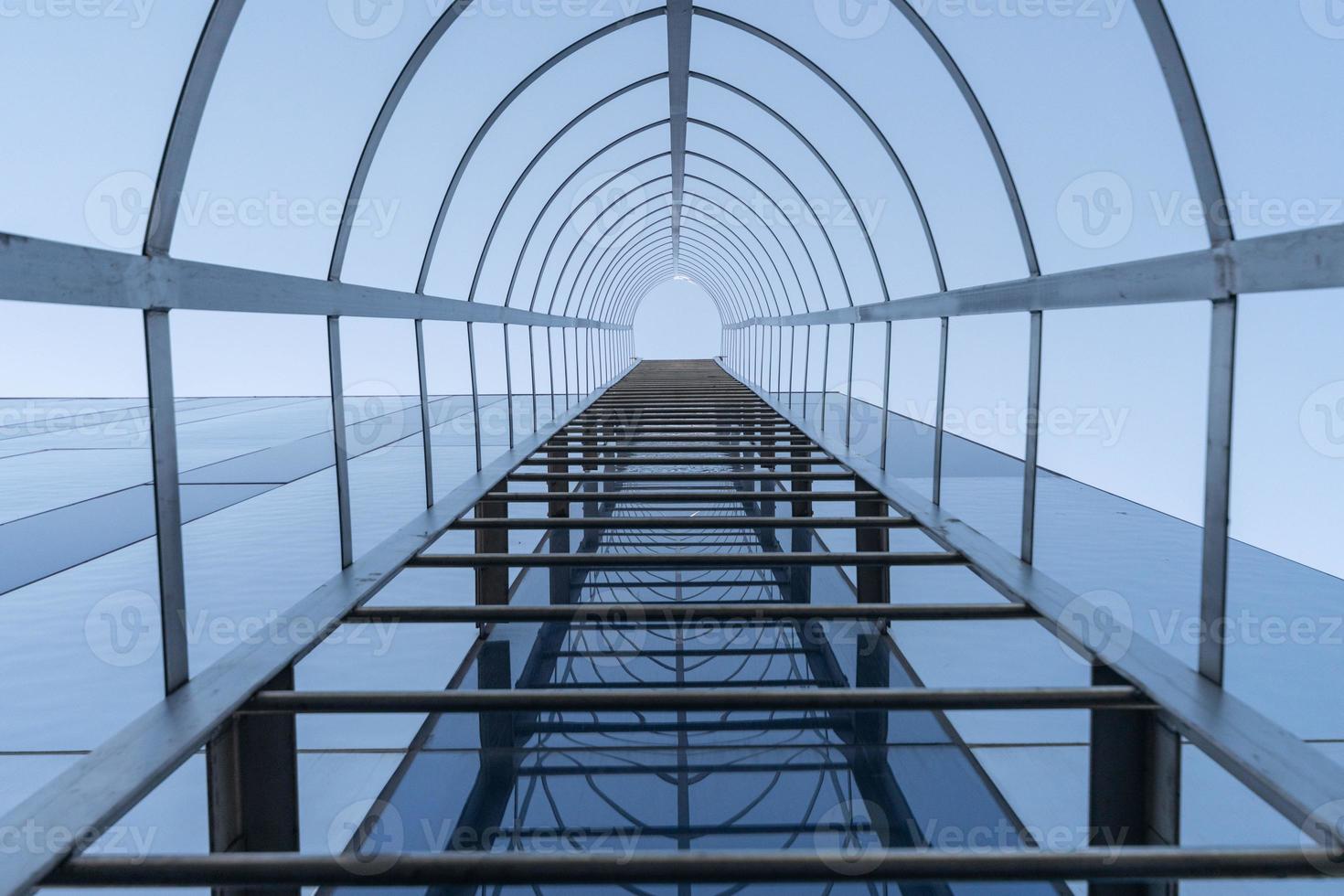 Fire escape staircase of modern business center. Stairway to Heaven concept. Emergency fire exit. Bottom view photo