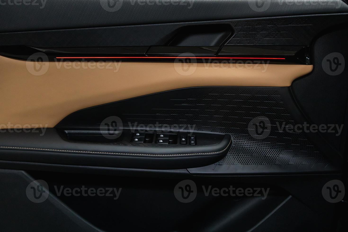Side door buttons window, mirror adjustment buttons, door lock. Car inside. photo