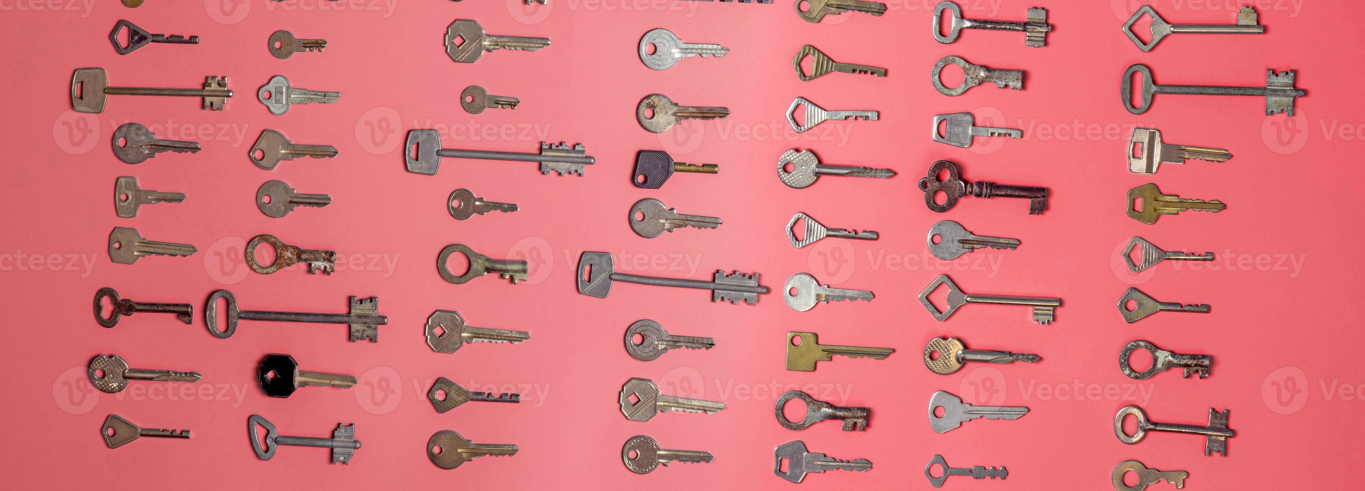 Keys set on pink background. Door lock keys and safes for proper photo