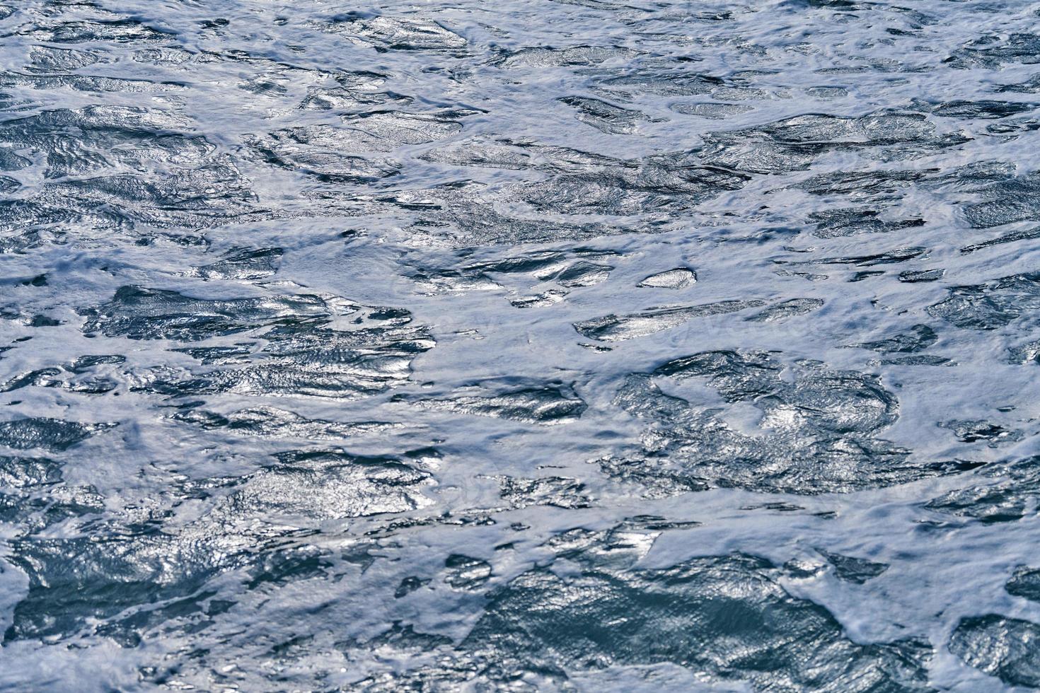 Dark foaming waves of stormy sea, background photo