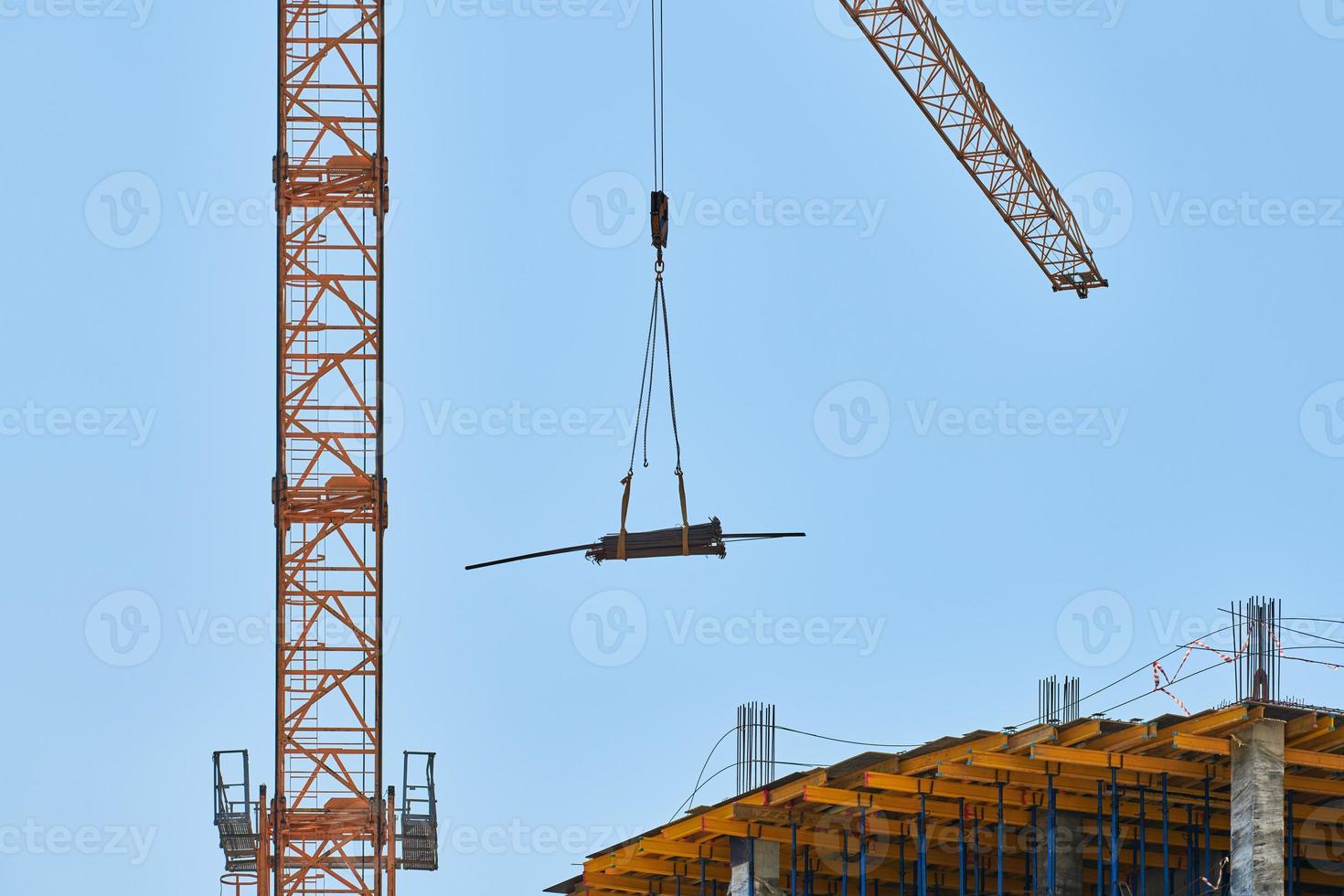Construction crane working on building complex photo
