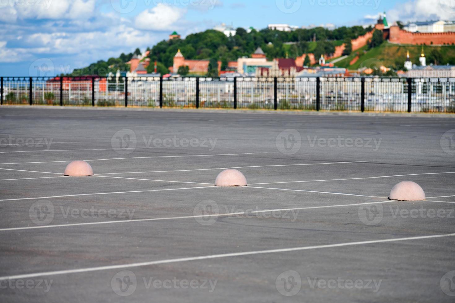 Concrete hemispheres parking limiter. Protection from car parking. Elements to restrict access to parking zone and control movement of vehicles photo