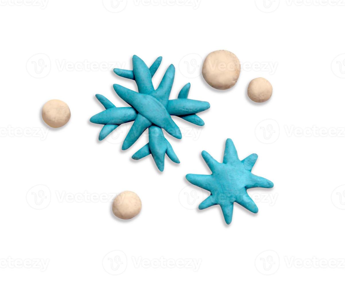 Plasticine snowflakes on a white background photo