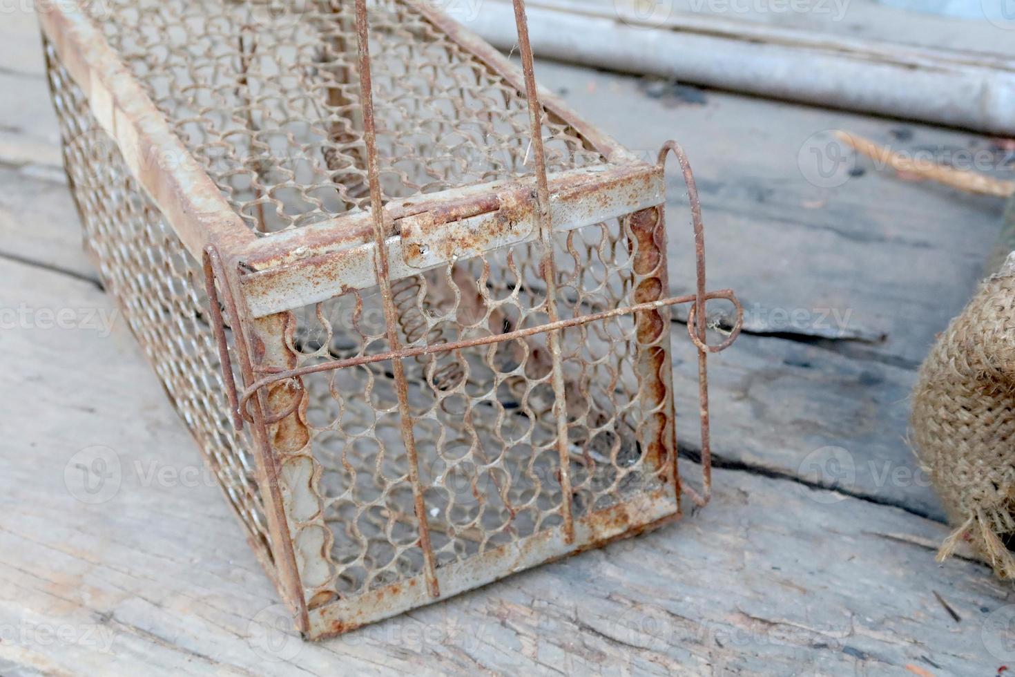 The old cage mousetrap with rusty. photo