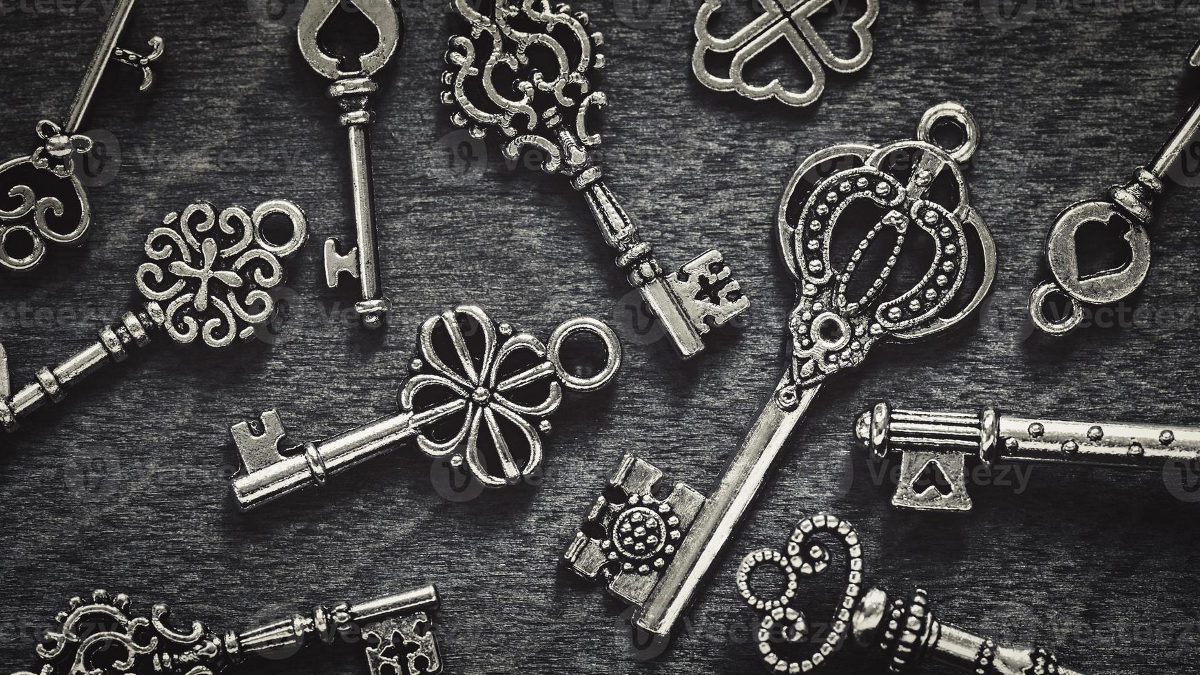 Vintage keys on gray wood background photo