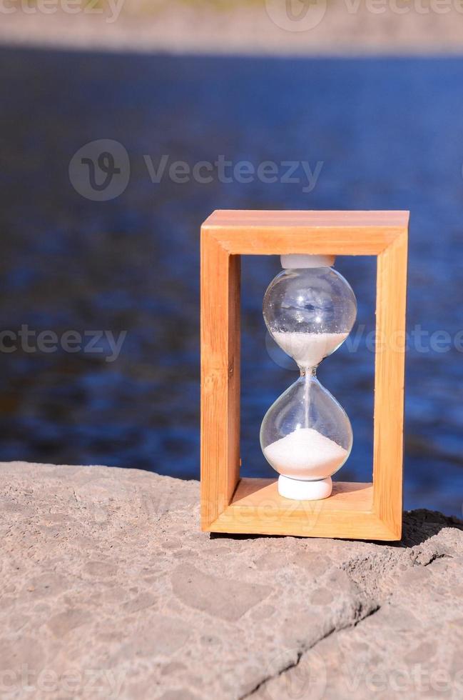 Hourglass with sand photo