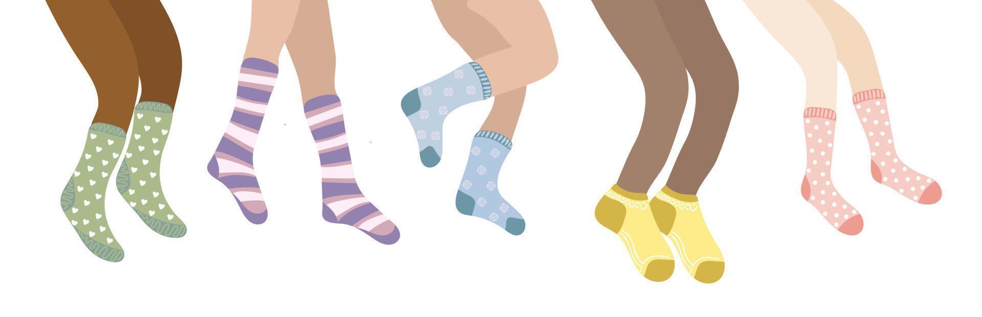 Set of people legs in colorful socks. Women legs different skin color in wool or cotton socks vector