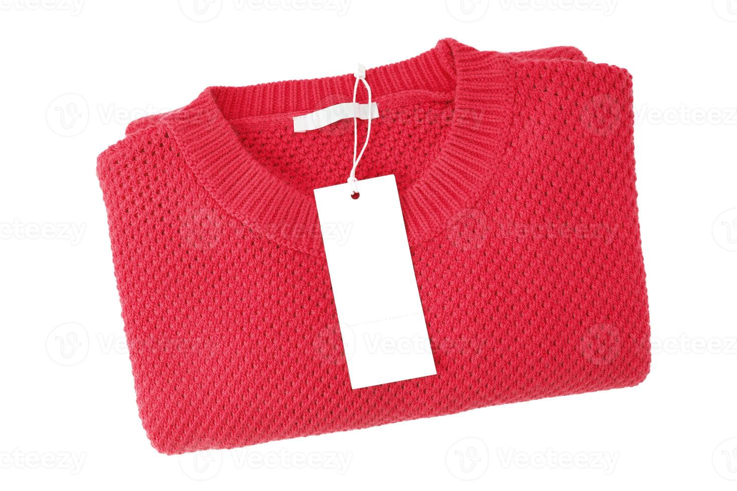 White blank rectangular clothing tag on red knitted sweater isolated on white background photo