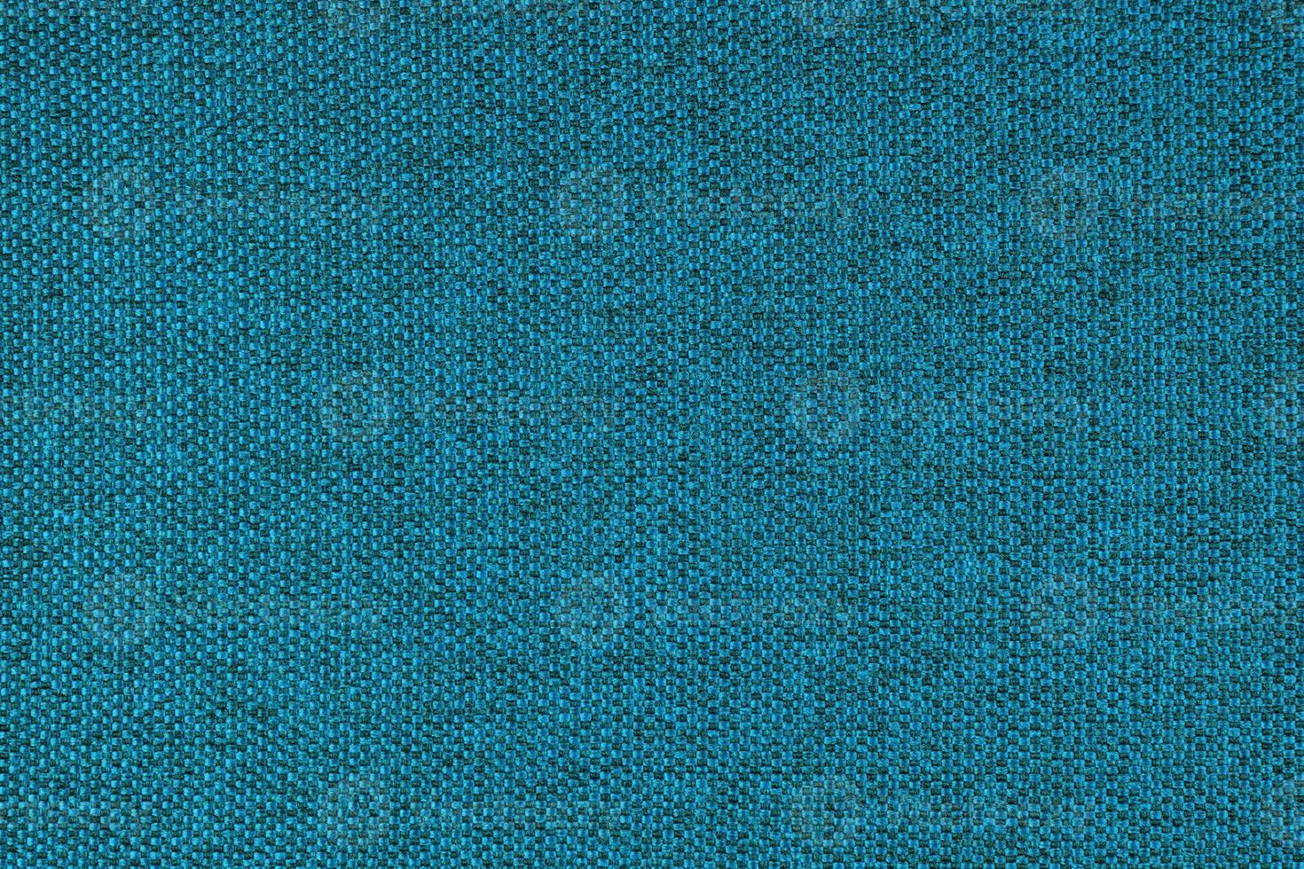 Close up texture of turquoise coarse weave upholstery fabric. Decorative textile background photo