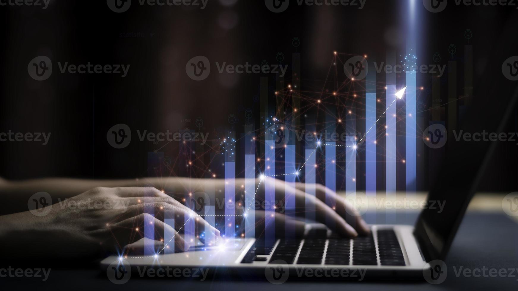 Businessman holding a graph goal of business Investor,analysis economic and calculates financial data and target for long-term investments and profitability in future on digital data system manager. photo